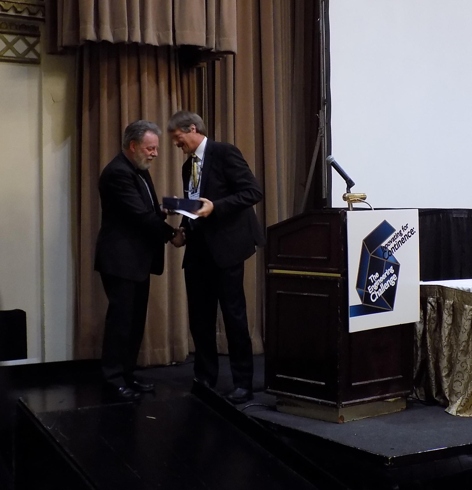 Professor Alan Cottenden, winner of the John J. Humpal Award receiving award from Christopher Payne, MD,