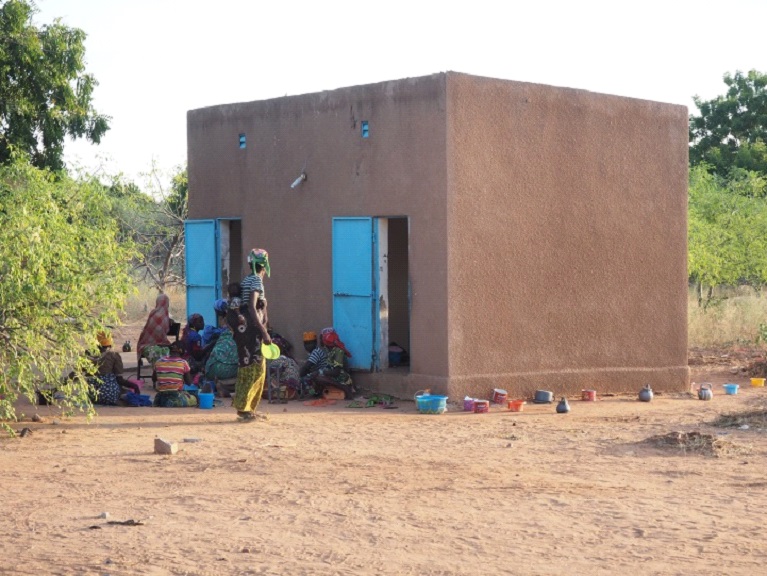 One of the living quarters, women eating dinner